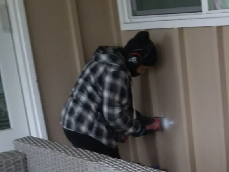 Professional electrician installing an exterior outlet in Avalon