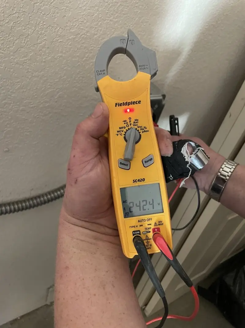 Voltage testing with clamp meter during Whole House Surge Protector in Avalon